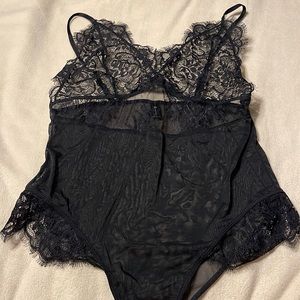 Black lace lingerie bodysuit.